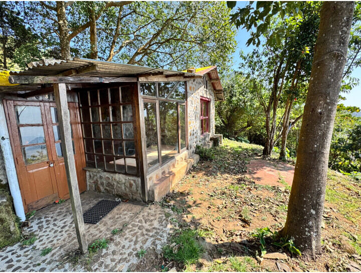 Shiuli House exterior with stone walls